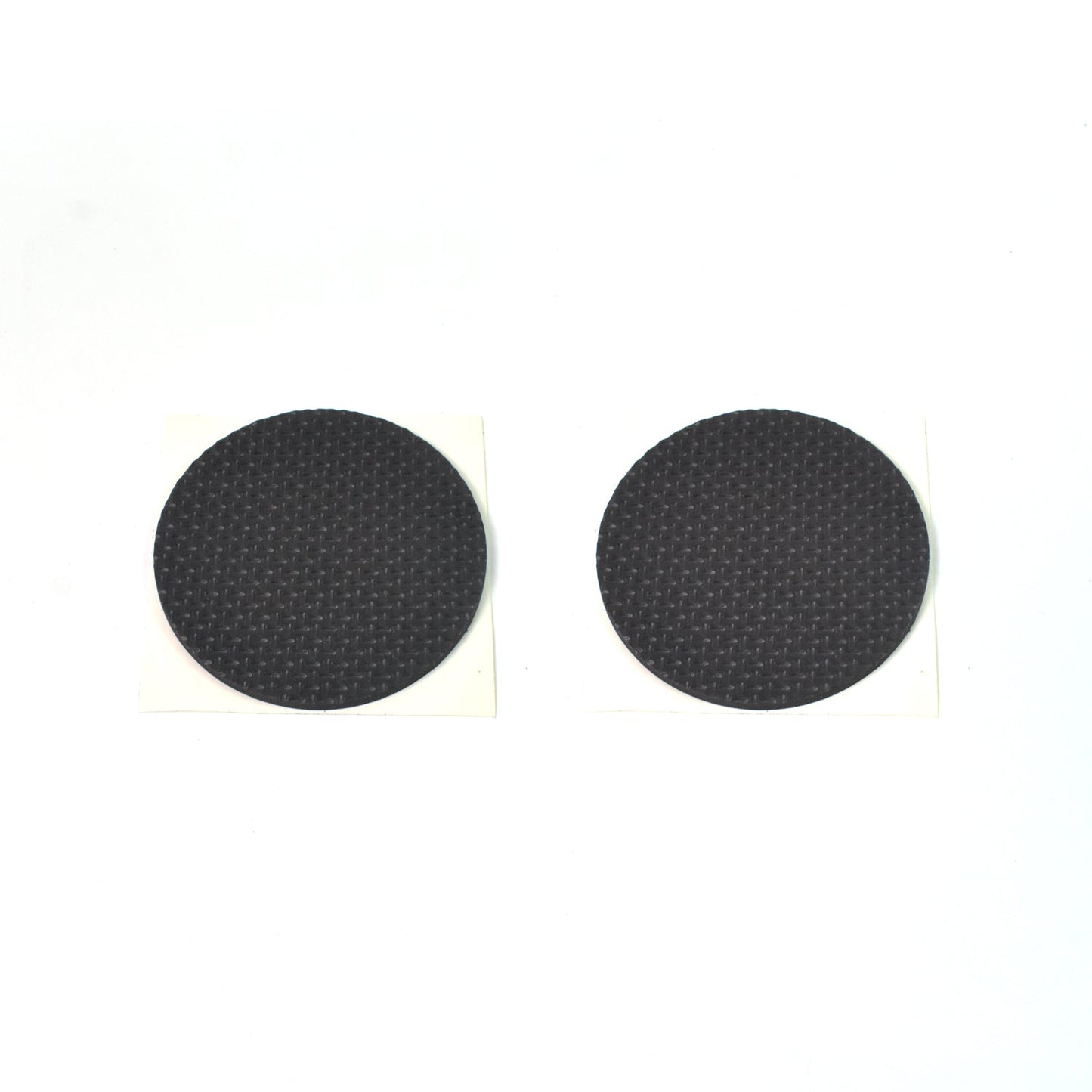 Various sizes of brown felt furniture pads laid out for floor scratch prevention.