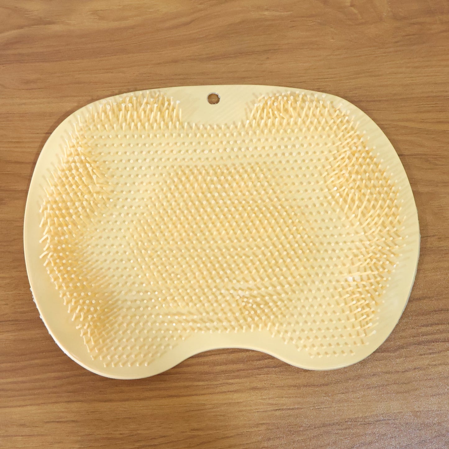 Premium-quality silicone foot scrubber mat in yellow for shower and bath use