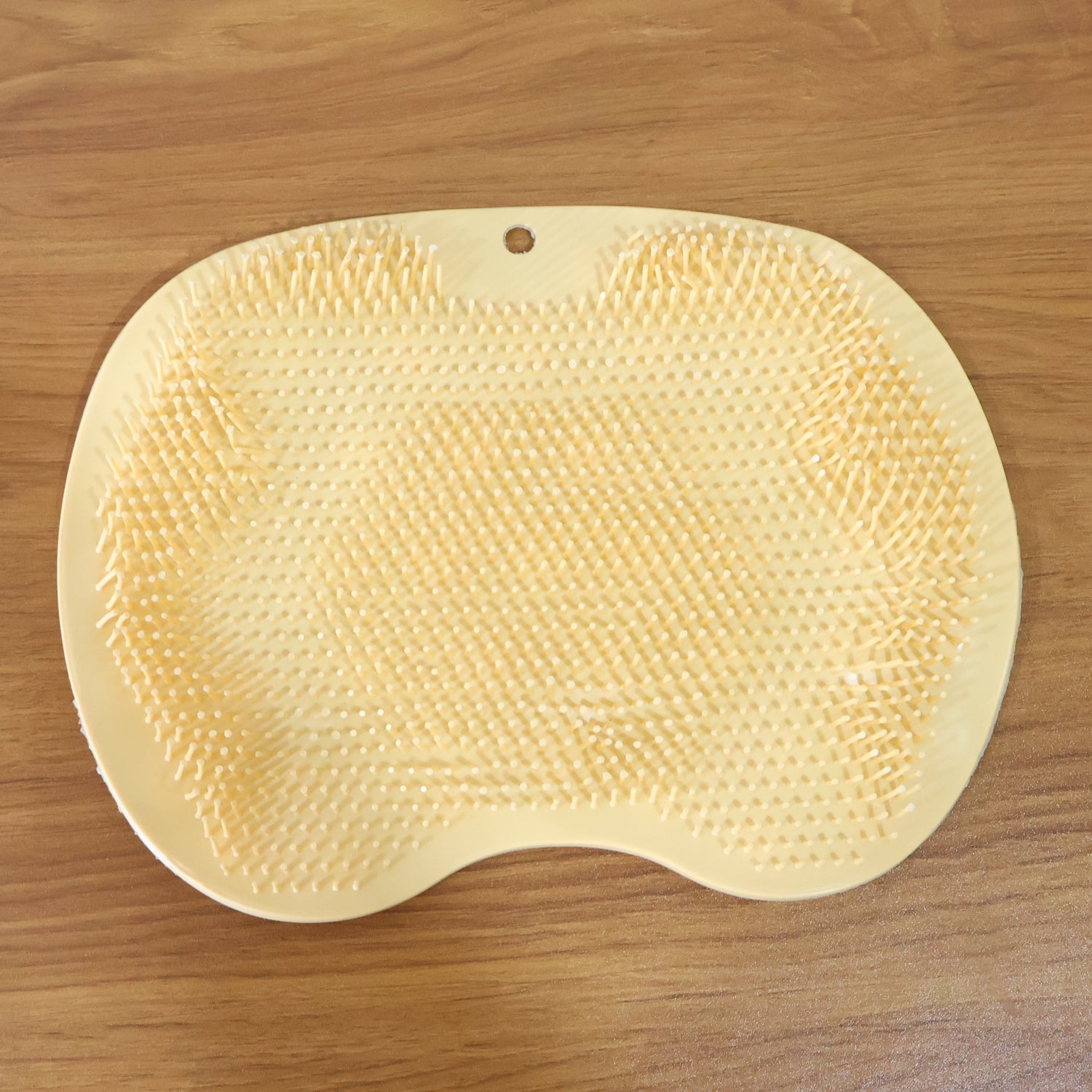 Premium-quality silicone foot scrubber mat in yellow for shower and bath use