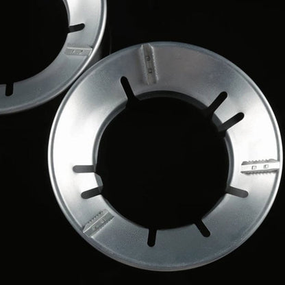 Energy-saving Gas Stove Stand placed on a burner for efficient cooking.