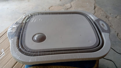 Top-down view of the collapsible cutting board and dish tub combo.