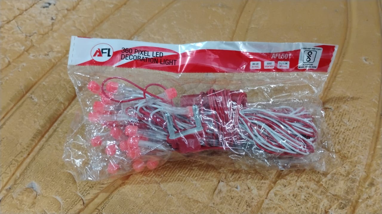Stretch of 10 meter LED decorative string fairy lights glowing red in evening