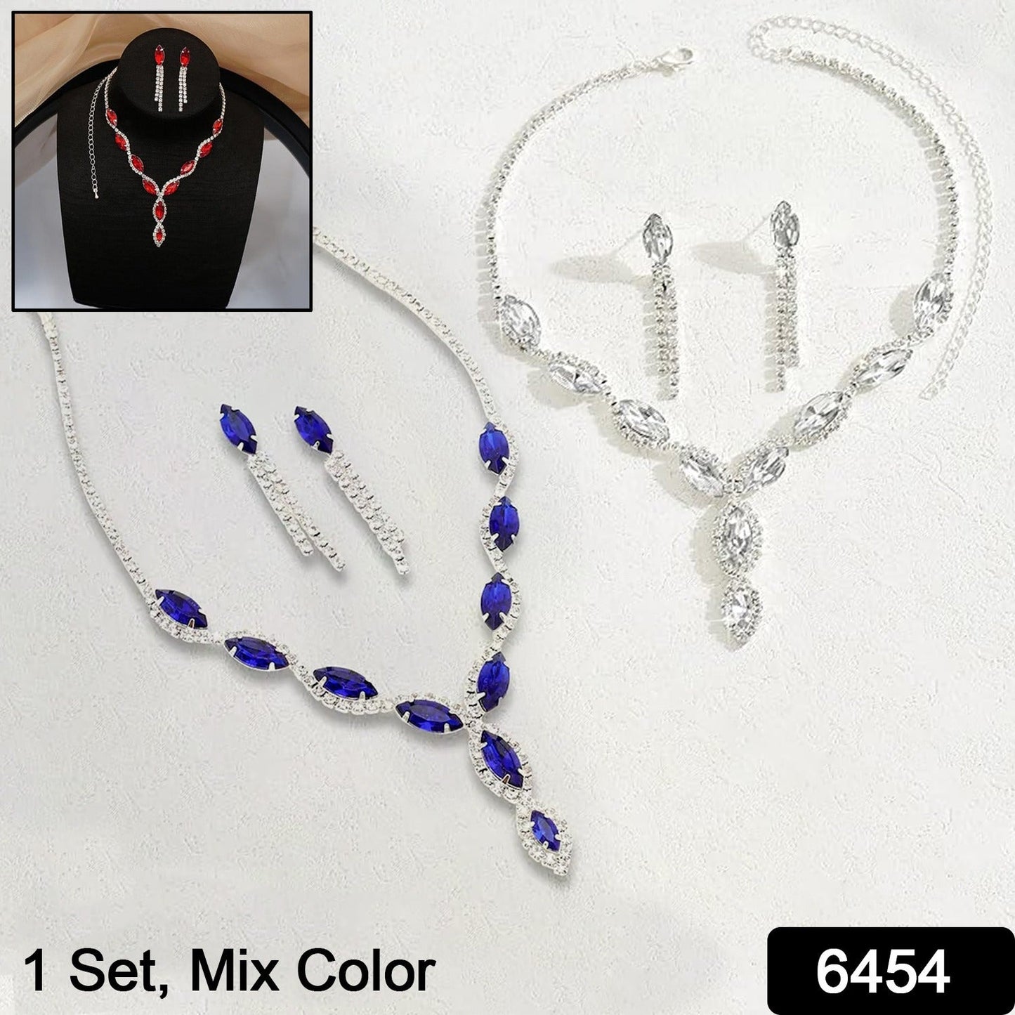 Close-up of a traditional Indian necklace and earring set with red stones.