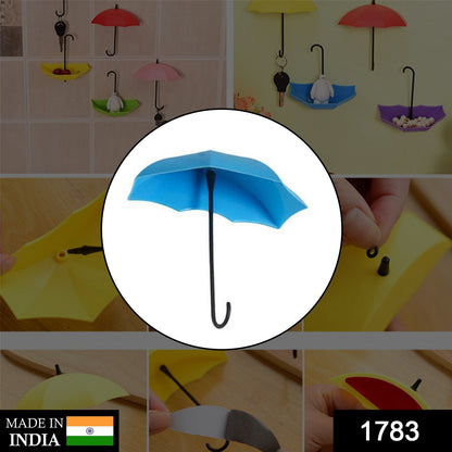 Set of three multi-coloured umbrella key holders arranged decoratively.