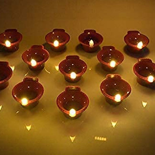 A group of glowing Water Sensor Diyas arranged for Diwali decoration.