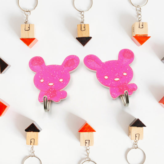 Pack of two strong self-adhesive hooks for versatile home organisation.