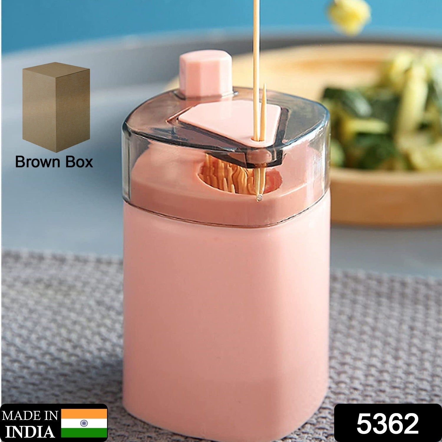 Sleek white automatic toothpick holder dispenser on a kitchen counter.