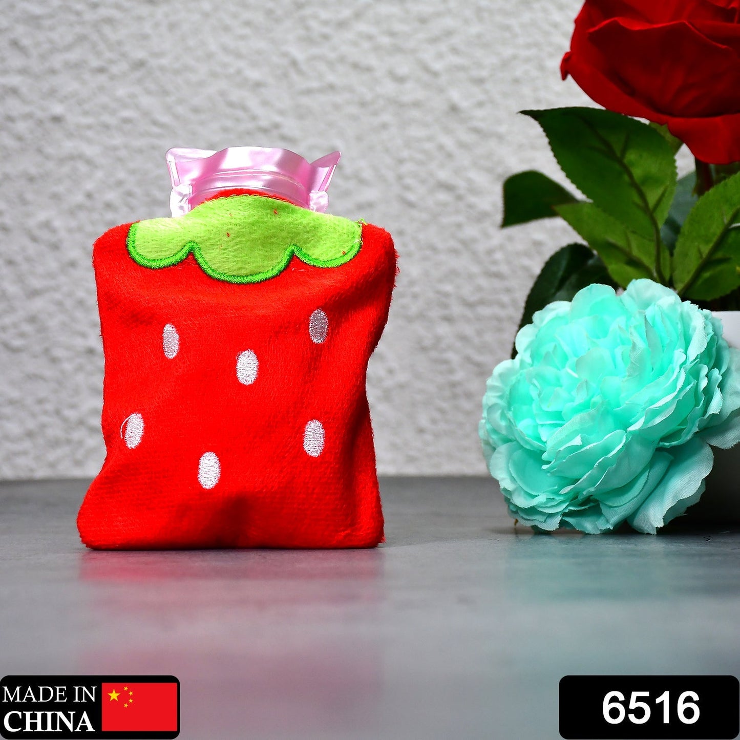 Strawberry design hot water bag, ideal for neck pain relief.