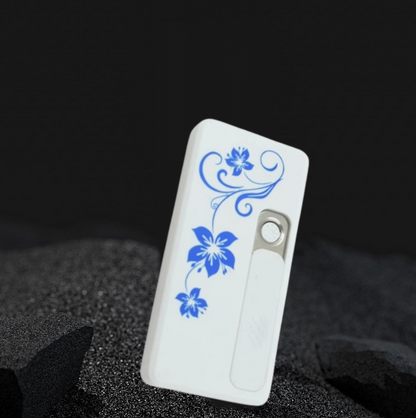 Modern flameless lighter with its USB charging cable.