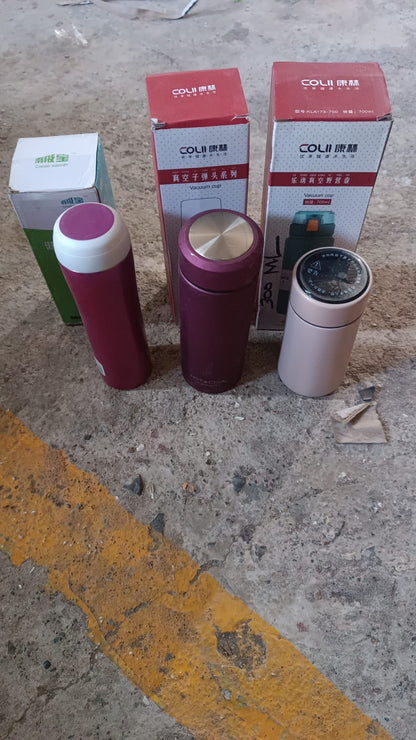 Group of assorted stainless steel insulated water bottles for travel