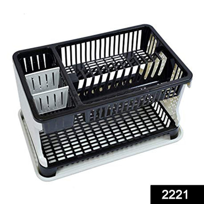 Multi-level kitchen dish rack organizing plates, cups, and cutlery.