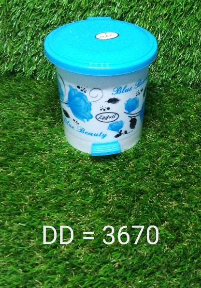 Small plastic dustbin with a foot pedal, perfect for maintaining a clean workspace.