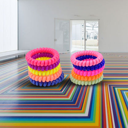 Flexible and strong telephone wire hair ties in various shades.