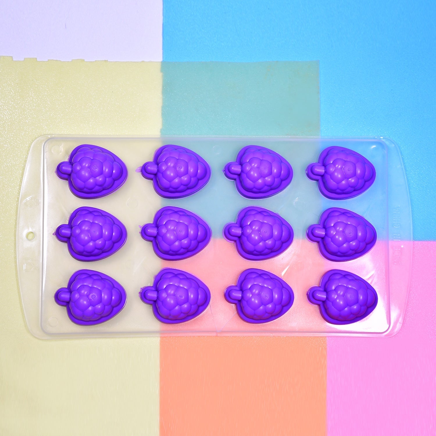 Side view of the easy-to-use silicone fruit ice cube tray.