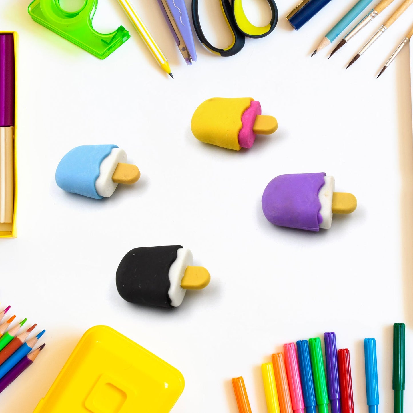 Themed erasers alongside pencils, illustrating their size and suitability as school supplies for kids.