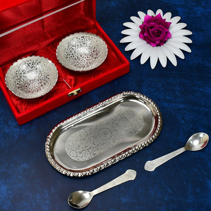 Close-up of the polished silver plated brass serving set, highlighting the intricate details of the bowls and spoons.