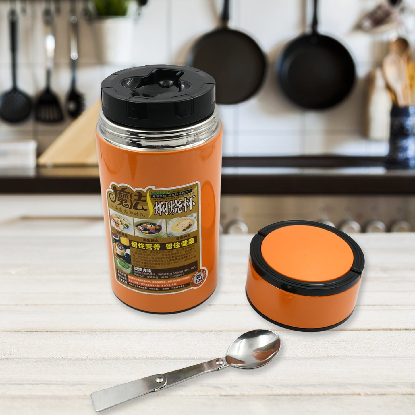 Close-up view of the leakproof lid, integrated handle, and foldable spoon on the durable water bottle.