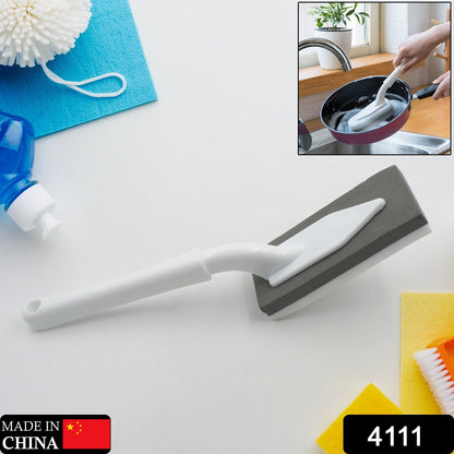 Versatile triangle cleaning brush effectively scrubbing a kitchen sink.