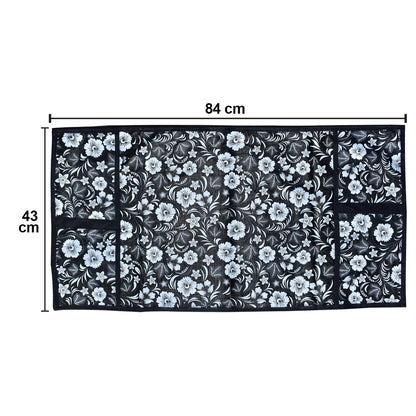 Microwave dust cover with an elegant design protecting a kitchen appliance.