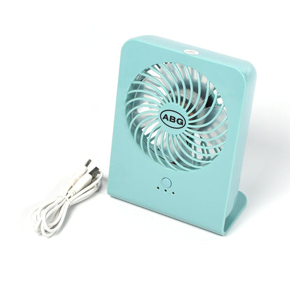 Close-up of the quiet four-blade design within the portable desk fan.