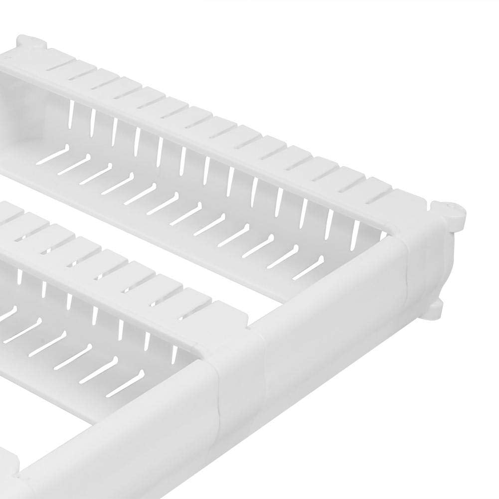 The versatile 2-tier slim storage rack holding various cleaning and kitchen supplies.