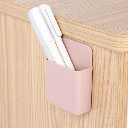 Pack of four wall mounted phone holders shown in their retail packaging.
