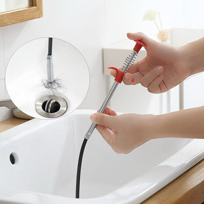 Detailed view of the drain cleaner tool's claw mechanism for grabbing stubborn clogs.