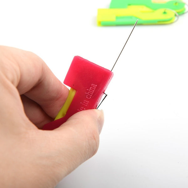 Vibrant multicolour automatic needle threader with a needle successfully inserted.