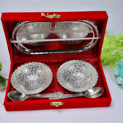 The two silver plated bowls and spoons neatly placed inside the rich red velvet gift box, ready for gifting.