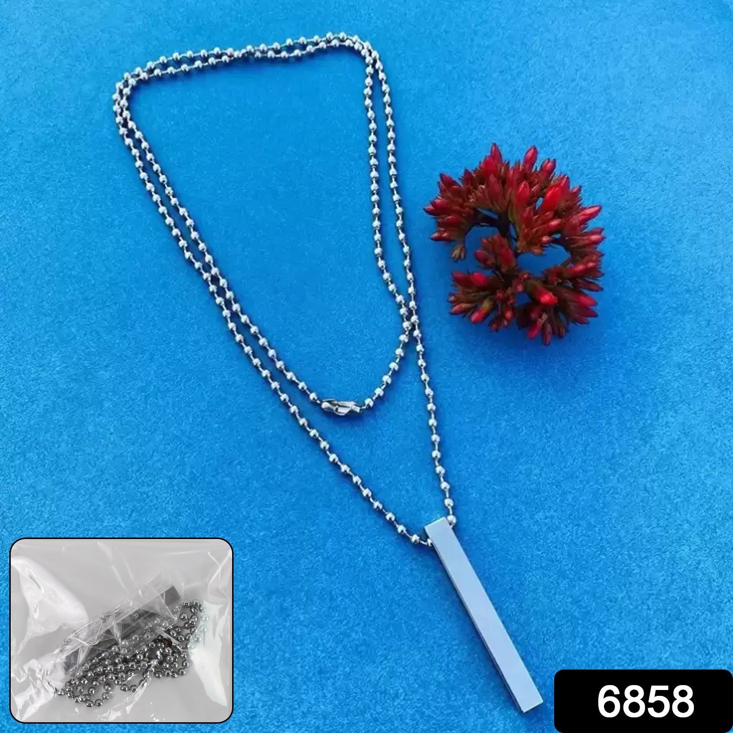 Close-up of the durable stainless steel chain and minimalist stick locket.