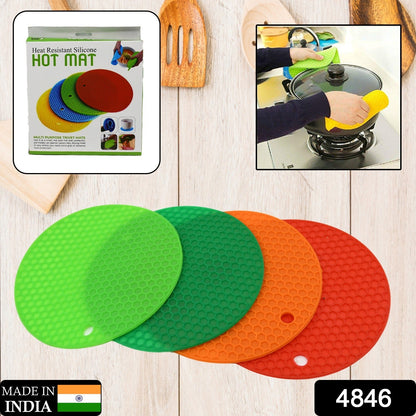 Four heat-resistant silicone hot pot mats stacked, ready to protect kitchen surfaces.