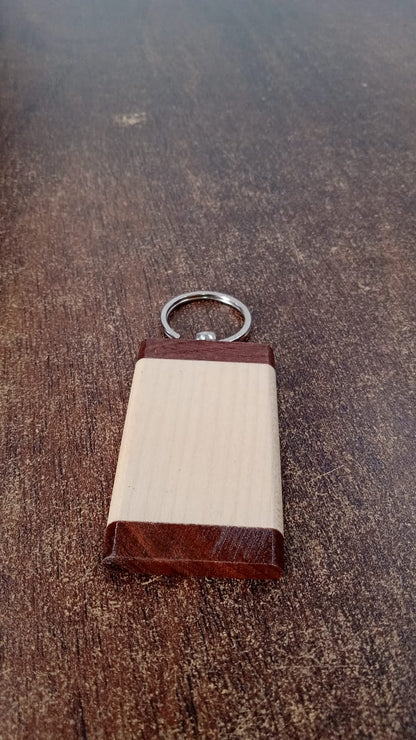 Wooden keychain placed in a lifestyle setting emphasizing natural style and functionality