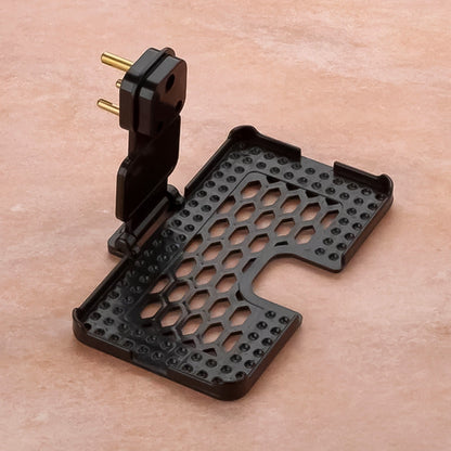 Close-up of the Mobile Charging Holder's open slots for ventilation and stable three-pin support.