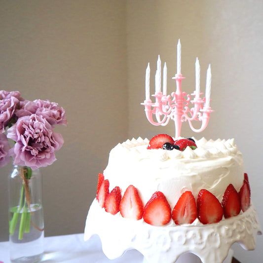 A dazzling set of luxury birthday candles with a candelabra stand, ready to adorn a celebration cake.