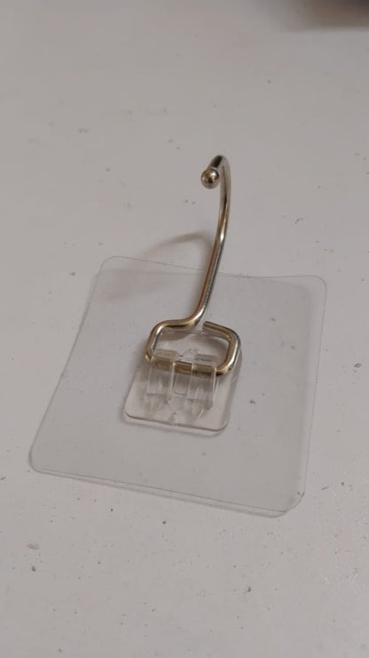 SteadyClear transparent adhesive wall hook holding towels and keys