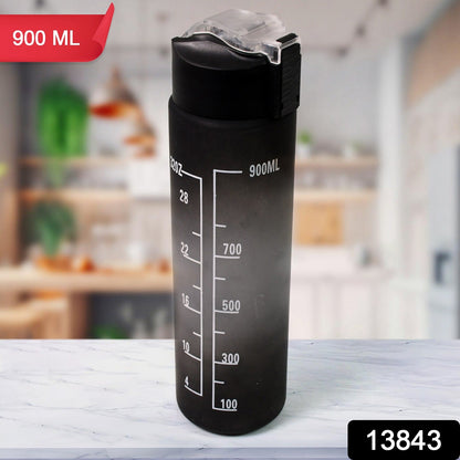 Ergonomic design of the black motivational water bottle with its integrated carry strap.