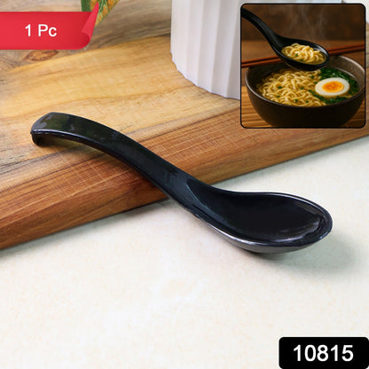 Side view of black plastic soup spoon ideal for serving noodles and soups