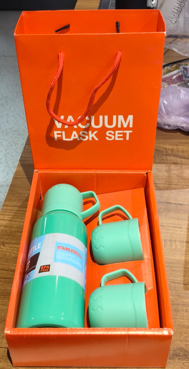 Compact green vacuum insulated flask set perfect for picnics and outdoor use