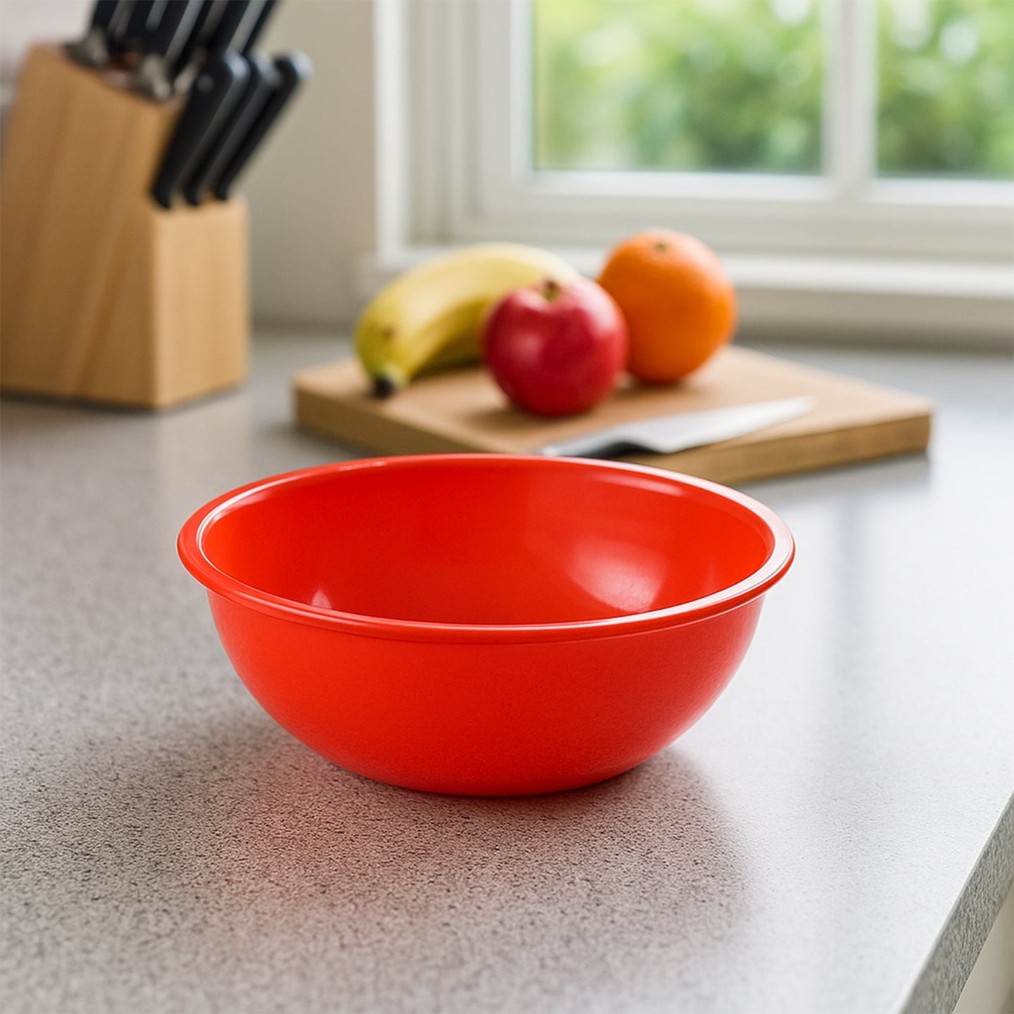 Stacked plastic red bowls showcasing lightweight design