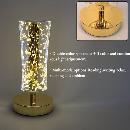 Close-up of golden metallic base and crystal acrylic shade with flakes lamp