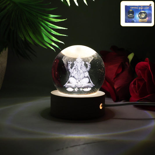 Close-up of a Ganesha 3D Crystal Ball Lamp radiating a warm glow.