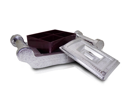 Decorative silver storage box with intricate patterns for organizing treats.