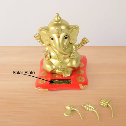 Decorative religious idol of Lord Ganesha with vibrant red base
