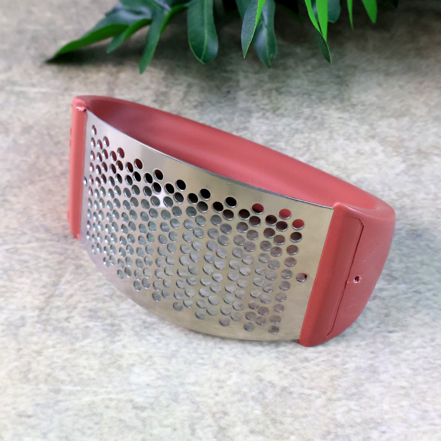 Backside view of Supermom garlic press crusher