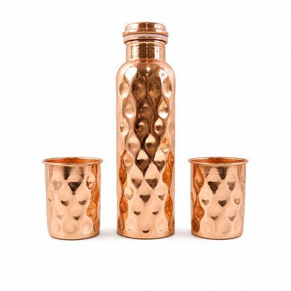 Detailed view of the sleek design and polished finish of the copper drinking glasses.