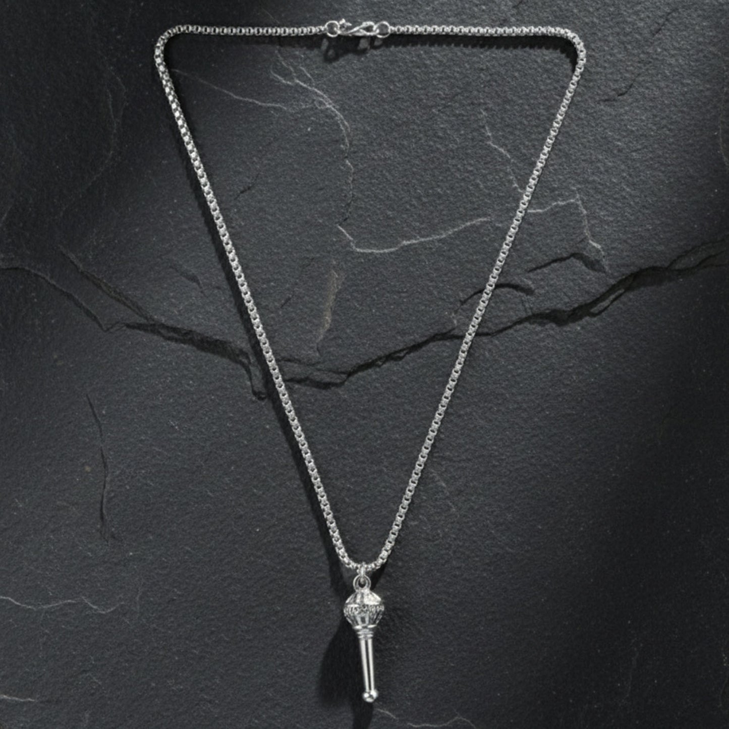 Another angle of the Hanuman Gada Pendant, emphasizing its symbolic design.