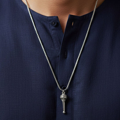 A detailed view of the Hanuman Gada Pendant with its accompanying chain.