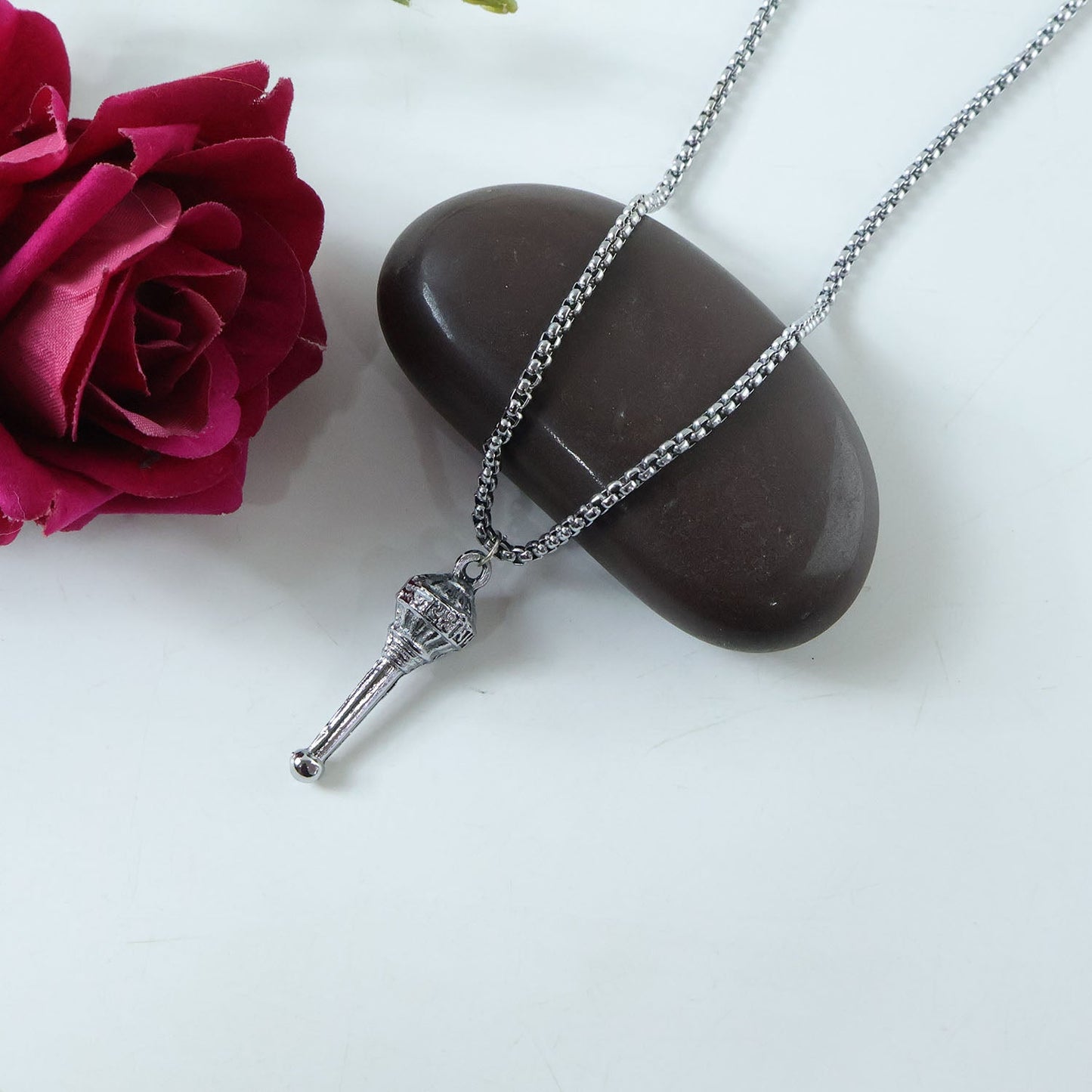 The Hanuman Gada Pendant and chain laid out, ready for gifting as a spiritual accessory.