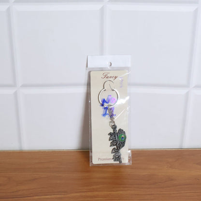 Lifestyle image showing Radha Krishna Radhe Radhe keychain in use