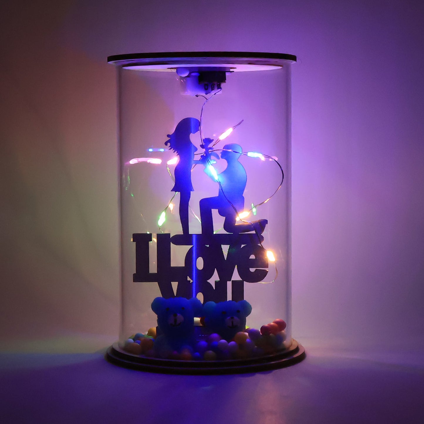Love themed figurine with bright LED lights and decorative balls